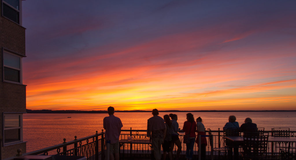 People Watching the Sunset at The Statehouse Terrace